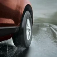 Landpioneer B61 all weather tire evacuating water on rainy road